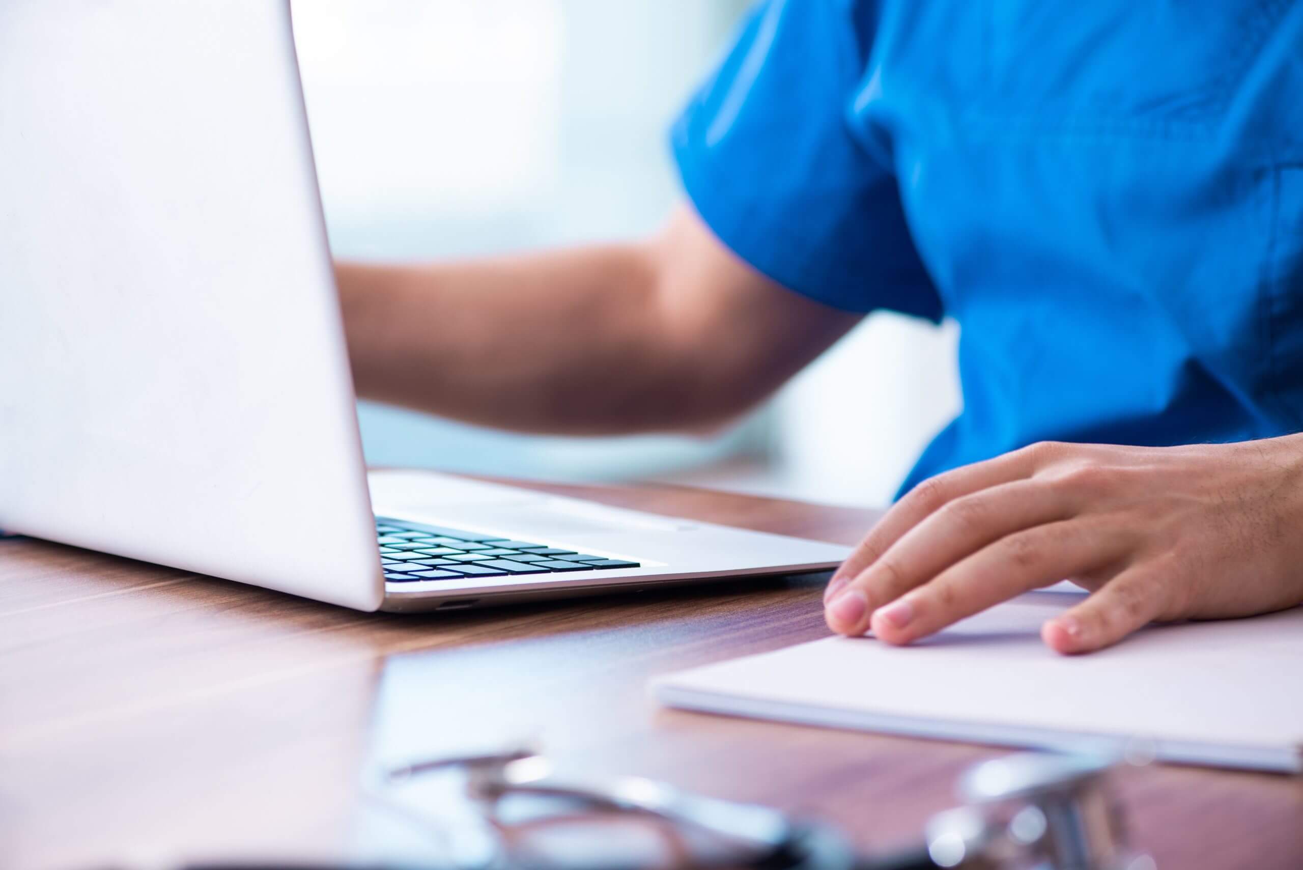 Patient on laptop with HIPAA compliance