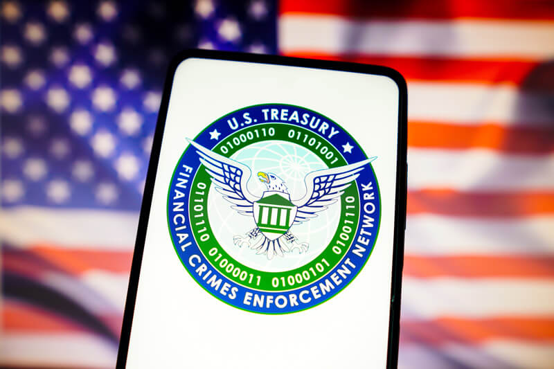 financial crimes enforcement network logo and-USA flag at PCS